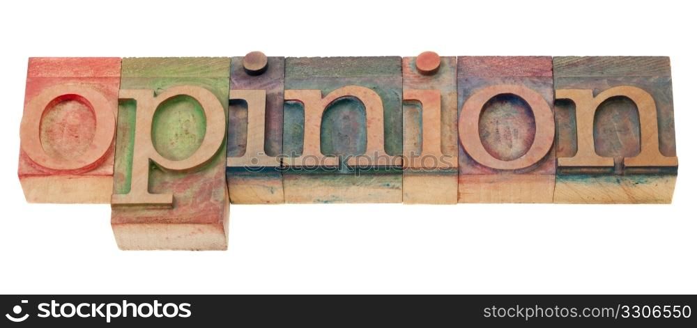 opinion word in vintage wood letterpress printing blocks, isolated on white