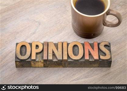 opinions word abstract in vintage letterpress wood type with a cup of coffee