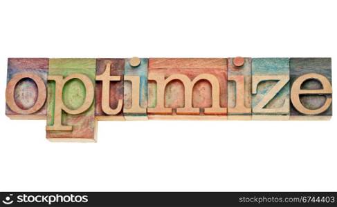 optimize - isolated word in vintage wood letterpress printing blocks stained by colorful inks