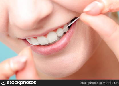 Oral hygiene and health care. Smiling women use dental floss white healthy teeth.. Woman smiling with dental floss.