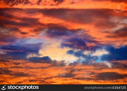 Orange and blue dramatic sky with clouds at sunset