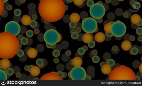 Orange and green full-spheres slowly fly against a dark background