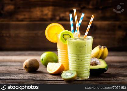 orange and green smoothies with exotic fruits, healthy eating, superfood