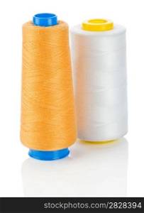 orange and white thread on spools isolated