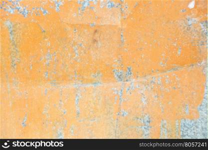 Orange background: metal surface with mint paint and creased texture