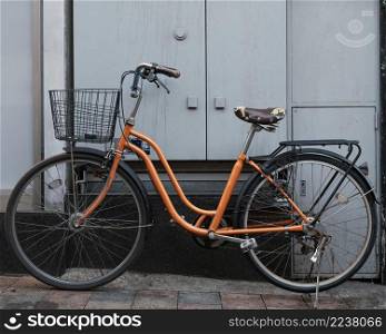 orange bicycle with basket