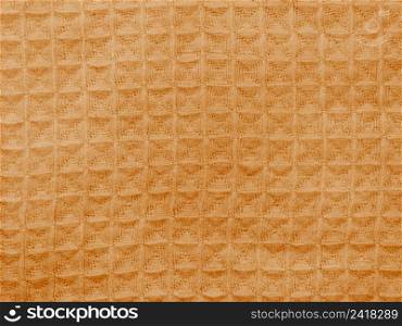 orange cloth with seamless crocheted pattern