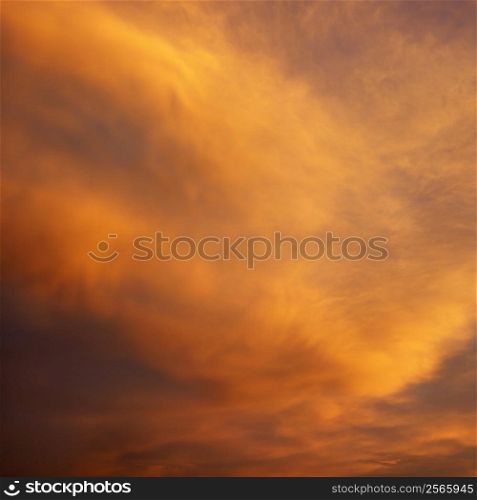 Orange clouds in sky with sunset.