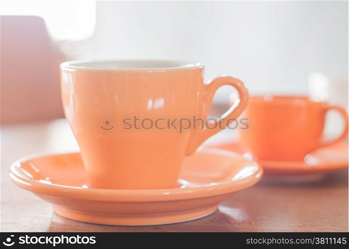 Orange coffee cup and mini orange coffee cup, stock photo