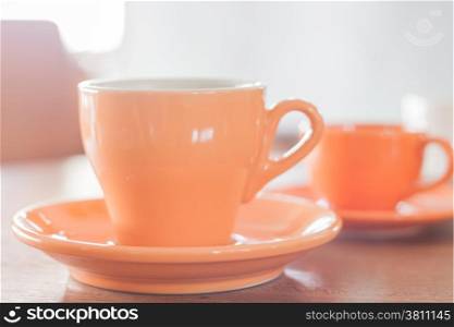 Orange coffee cup and mini orange coffee cup, stock photo