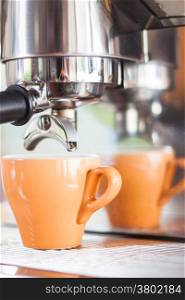 Orange cup of coffee for espresso, stock photo