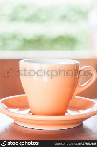 Orange cup of coffee with espresso shot, stock photo