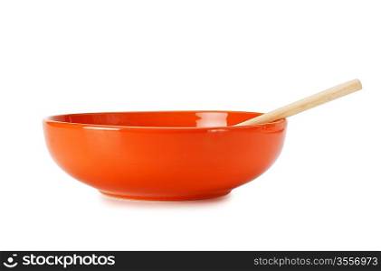 orange empty ceramic bowl and wooden spoon isolated on white background