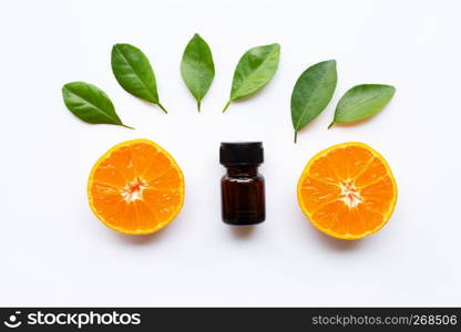 Orange essential oil with fresh fruits on white background.
