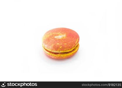 Orange French macaroon isolated on white background. Tasty colorful macaroons. French pastry made from egg whites. Culinary and cooking concept.