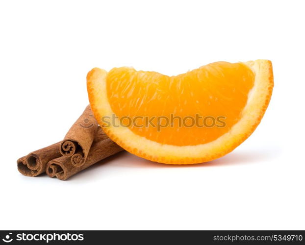 Orange fruit segment and cinnamon sticks isolated on white background. Hot drinks ingredients.