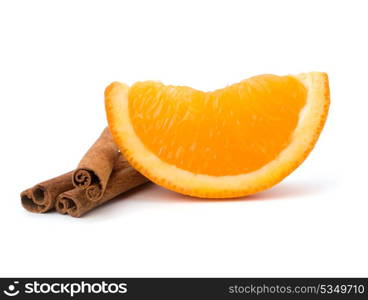 Orange fruit segment and cinnamon sticks isolated on white background. Hot drinks ingredients.