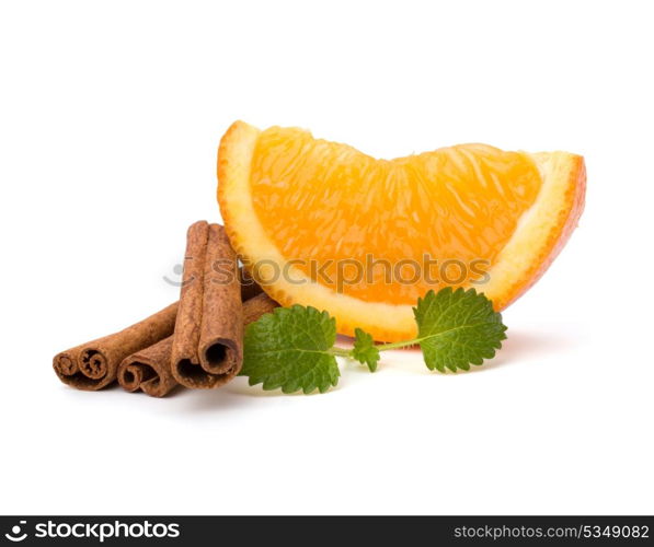 Orange fruit segment, cinnamon sticks and mint isolated on white background. Hot drinks ingredients.