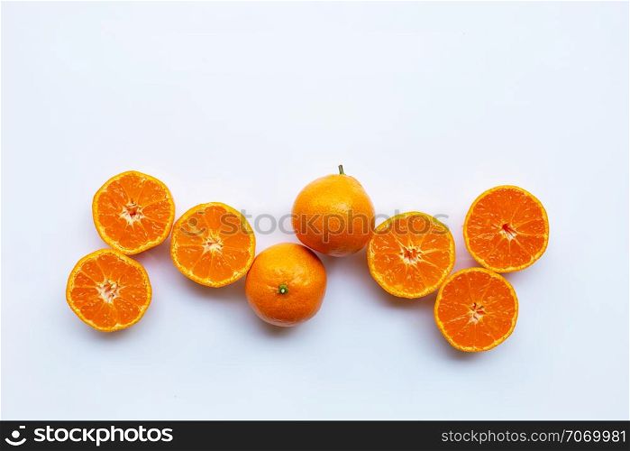 Orange fruits on white background. Top view