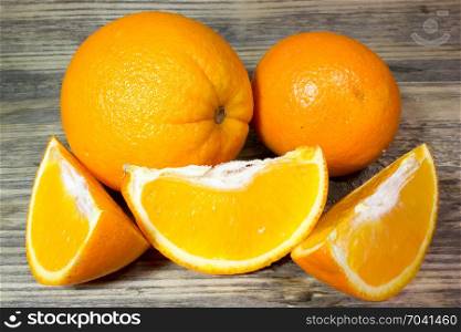 Orange fruits on wooden background