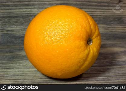 Orange fruits on wooden background