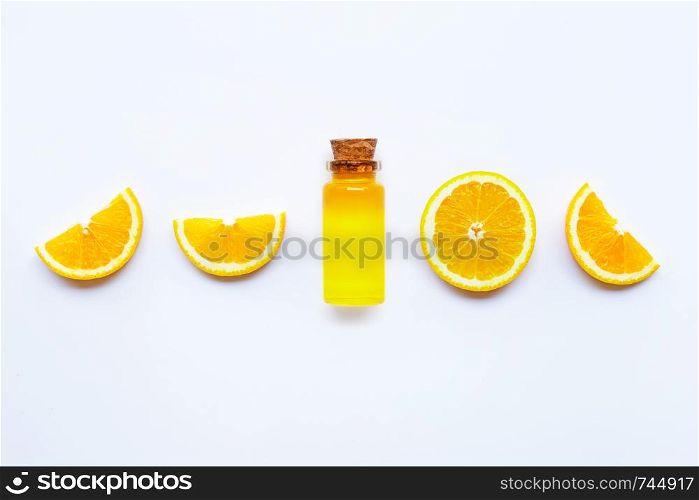 Orange fruits with citrus oil. Natural vitamin C on white background. Top view