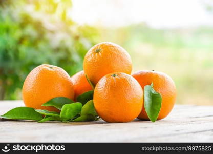 Orange fruits with leaf on wooden and nature background, fresh orange with leaves healthy fruits