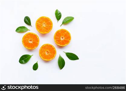 Orange fruits with leaves on white background. Top view, Copy space