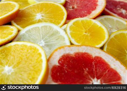 Orange grapefruit and lemon cut. heap of orange grapefruit and lemon cut in pieces