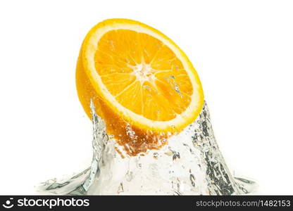 Orange half splashing into water and sinking isolated on white background. Citrus drink concept. Healthy food. Orange half splashing into water and sinking isolated on white background. Citrus drink concept.