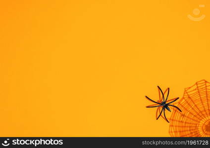 orange halloween background. the shadow of the web and the black spider. orange halloween background. shadow of web and black spider