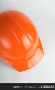 Orange helmet closeup on a white background
