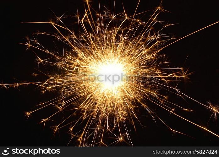 Orange holiday sparkle- fireworks on the black background