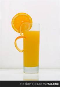 orange juice in a glass with a grapefruit slice. drink isolated on white background. fruit drinks in a glass