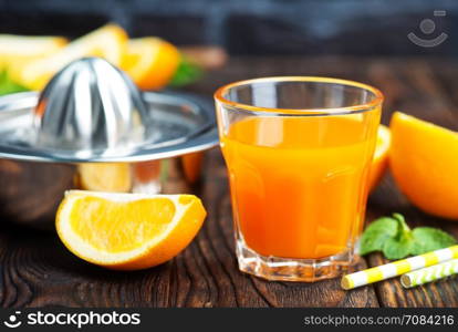 orange juice in glass and fresh fruits