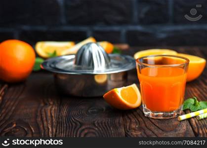 orange juice in glass and fresh fruits