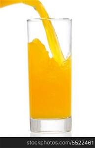 orange juice is pouring into glass on white background