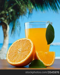 orange juice on a beach table