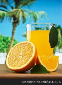 orange juice on a beach table
