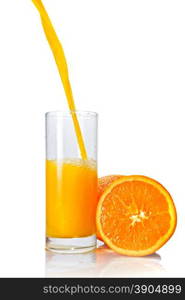 orange juice poring into glass isolated on white