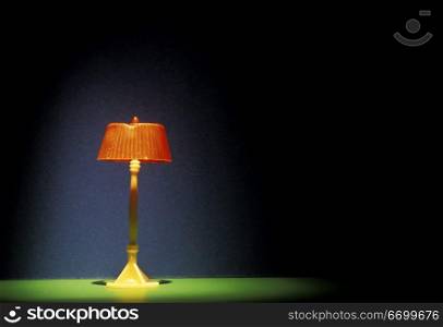 Orange Lamp on Green Table
