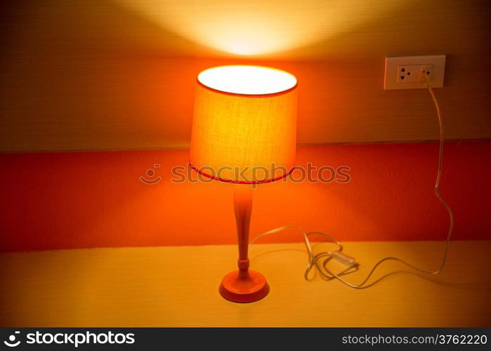 orange lamp on table