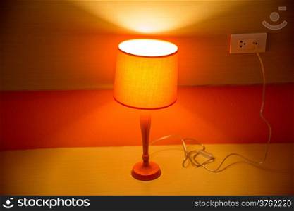 orange lamp on table