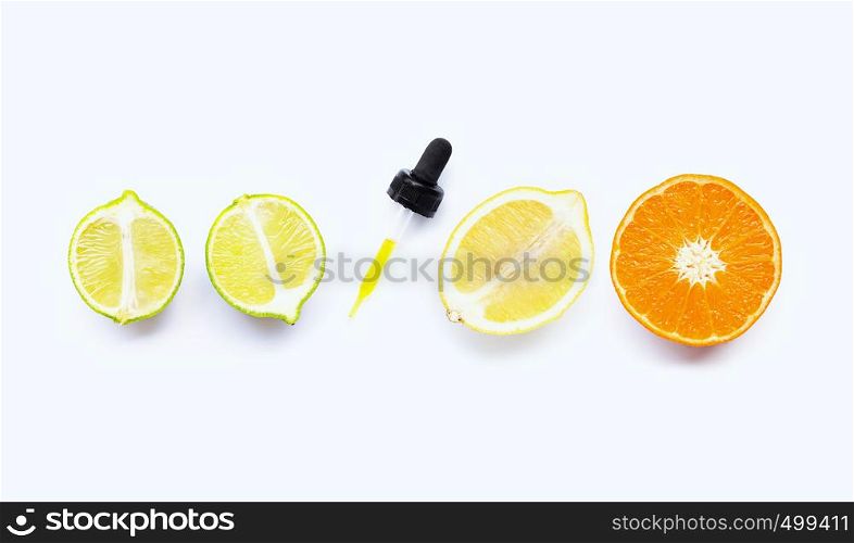 Orange, lime and lemon with dropper on white background.