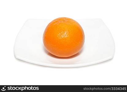 Orange mandarin with plate isolated on white.