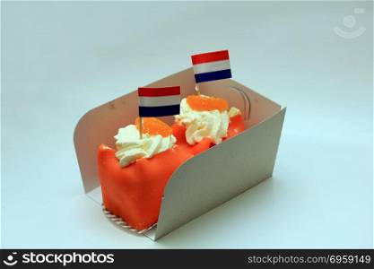 Orange Marzipan confectionery with Dutch flag to celebrate King&rsquo;s Day on April 27th. Orange is the national color in the Netherlands. Orange Marzipan confectionery