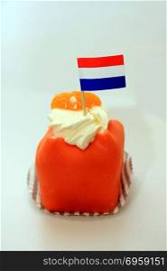 Orange Marzipan confectionery with Dutch flag to celebrate King&rsquo;s Day on April 27th. Orange is the national color in the Netherlands. Orange Marzipan confectionery