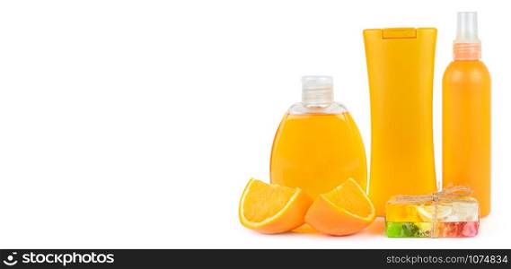 Orange natural cosmetic products: Suntan oil and handmade soap . Vials isolated on white background. Face and body skin care. Free space for text. Wide photo.