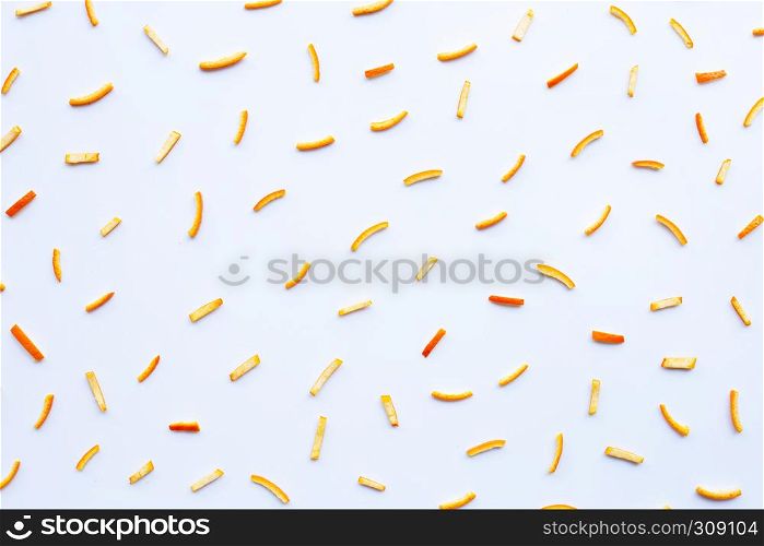 Orange peels on white background. top view