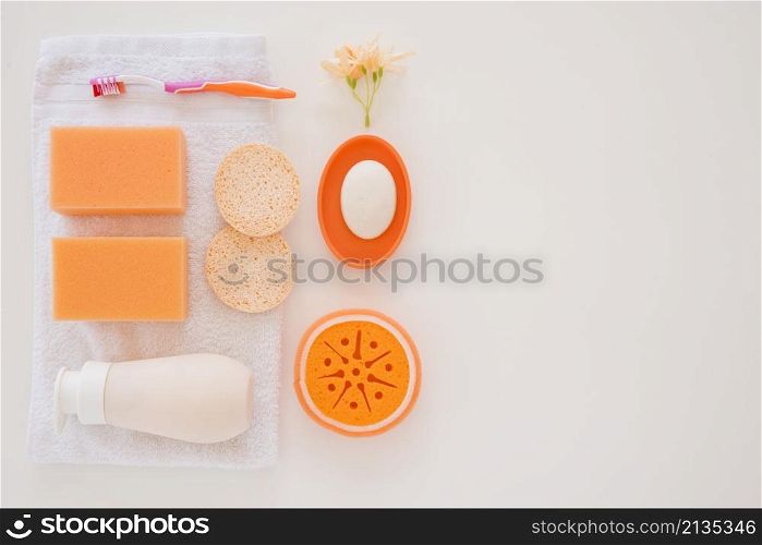orange personal care products white towel